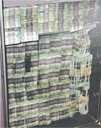  ??  ?? These bundles of $20 bills seized in October 2015 were part of $220 million a year allegedly laundered through an undergroun­d Richmond bank, but the prosecutio­n of the bank’s owners broke down on several levels.