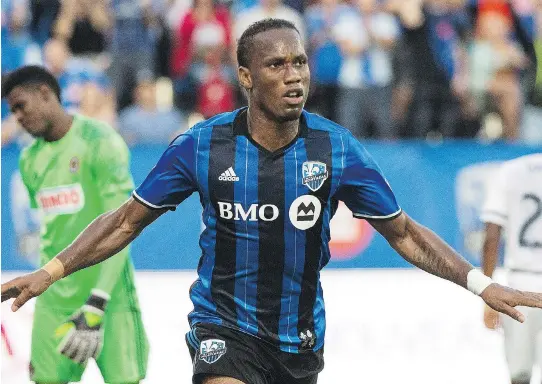  ?? GRAHAM HUGHES/THE CANADIAN PRESS FILES ?? The Impact’s Didier Drogba celebrates after scoring against the Philadelph­ia Union in Montreal on July 23.