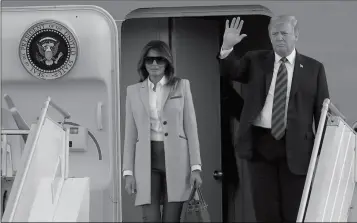  ?? ASSOCIATED PRESS ?? U.S. PRESIDENT DONALD TRUMP waves as he and his wife Melania arrive at the airport in Helsinki, Finland, Sunday on the eve of his meeting with Russian President Vladimir Putin.