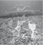  ?? ENBRIDGE VIA U.S. SENATE ?? An underwater image from Canadian oil transport giant Enbridge shows deep grooves in the Straits of Mackinac lake bottom, going up and over one of the twin Line 5 oil pipelines and leaving damage to the pipe’s outer coating, the result of a 2018 anchor strike.