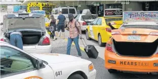  ?? KEVIN SPEAR/STAFF ?? Orlando Internatio­nal Airport is preparing for the July 1 start of Uber and Lyft cars being allowed to pick up passengers. The ride-share services previously could only drop off passengers at OIA.