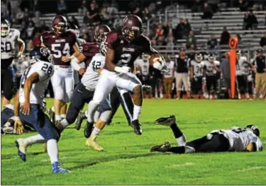  ?? AUSTIN HERTZOG - DIGITAL FIRST MEDIA ?? Pottsgrove running back Rahsul Faison makes a Pottstown defender miss as he rushes to the 2-yard line to set up one of his four first-half touchdowns Friday against Pottstown.