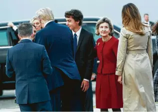  ?? Doug Mills / New York Times ?? Kay Bailey Hutchison, the U.S. ambassador to NATO, second from right, greets President Donald Trump and first lady Melania Trump as they arrive Tuesday in Brussels, Belgium.