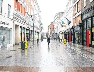  ?? PHOTO: GARETH CHANEY/ COLLINS ?? All quiet: A normally bustling Grafton Street in Dublin city centre was eerily void of people yesterday.