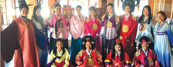  ??  ?? ANNYEONG HASEYO! Davao girl scouts wear the traditiona­l Korean costume hanbok. (Standing from left) Anicka Teves, Jessa Canaynay, Karen Lantajo, Anna Roque, Cherry Ann Torres, Jedelle Falcon, Mary Therese Atienza, Natalia Uy and Jian Lasala; (Seated...