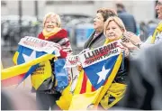  ?? AFP ?? People holding Catalan flags protest prior to the handing over of a petition in the Hague for the release of Catalan separatist­s being held in Spain, on Tuesday.