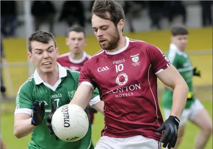  ??  ?? Eoin Carroll and Conor Maher in action. Pic: Carl Brennan.