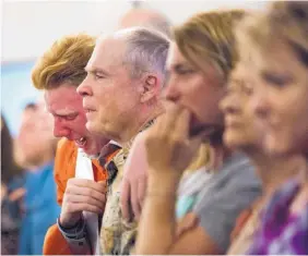  ?? MARIE D. DE JESUS/HOUSTON CHRONICLE ?? Nathan Jordan, 18, a senior at Alvin High School, sobs Sunday during a service at the Arcadia First Baptist Church in Texas for the 10 Santa Fe High students who were killed.