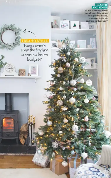  ??  ?? idea to steal ‘Hang a wreath above the fireplace to create a festive focal pointõ HEARTH And HOME ‘the wood burner, which was already here when I bought the house, adds country-style cosiness to this room’