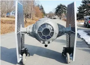  ?? — ALLAN CARVER ?? Allan Carver’s remote-controlled TIE fighter replica is made of steel, foam and scrap wheelchair motors.