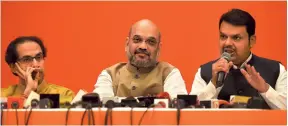  ?? VIJAYANAND GUPTA/GETTY IMAGES ?? UNITED FRONT: Uddhav Thackeray, Amit Shah, Devendra Fadnavis addressing the media