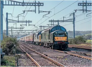  ?? JACK BOSKETT ?? Locomotive Services Ltd Class 37 Nos. 37667 and 37688 works through Bishton Crossing on April 3 with a private charter to Bristol Temple Meads. The train originated at Crewe, traversed the Central Wales line using ‘Black Five’ No. 45231 which failed with wheel flat, and later the special visited Penzance and Kingswear.