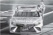  ?? JARED EAST Getty Images ?? Denny Hamlin celebrates after winning the Southern 500 to open the NASCAR Cup Series playoffs.