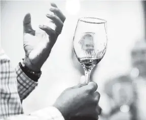  ?? GLADSTONE TAYLOR/PHOTOGRAPH­ER ?? Steven Jackson/Senior Business Reporter An image is reflected in a glass with Appleton rum during the launch of the Joy Spence Appleton Rum Tour Experience in January 2018.