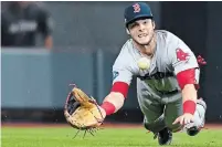  ?? CHRISTOPHE­R EVANS THE ASSOCIATED PRESS FILE PHOTO ?? Andrew Benintendi of the Boston Red Sox makes a diving catch with the bases loaded for the final out in the ninth inning against the Astros in Game 4 of the ALCS in Houston on Oct. 17, 2018.