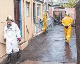  ?? Pictures: Eddie Safarik ?? Fire badly damaged a unit above Pigeon Hole Cafe in West Hobart.