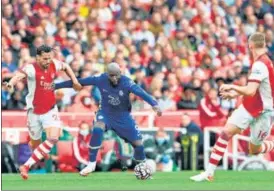  ?? AFP ?? Romelu Lukaku, back in Chelsea, holds off Arsenal's Pablo Mari (L) in the Premier League at the Emirates Stadium on Sunday.