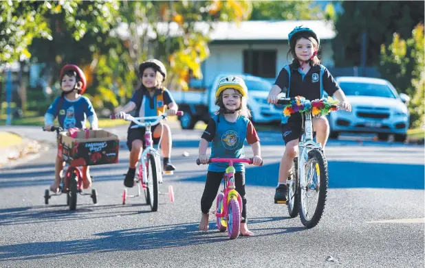  ?? Picture: STEWART McLEAN ?? SAFETY: Iarlaith Burke, 4, Saoirse Burke, 6, Addison Dunstan, 3, and Molly Dunstan, 7, enjoy riding in their cul-de-sac at Ixora Ct at Mooroobool.