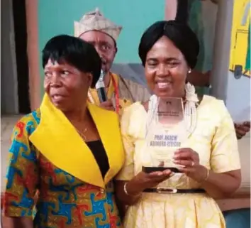 ??  ?? Prof. Akachi Adimora-ezeigbo receiving a plaque of honour from her host and HOD, Department of English, Lagos State University (LASU), Ojo, Lagos, Dr. Rachel Bello after her reading performanc­e