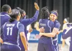  ?? COURTESY OF COLIN MITCHELL/CONFERENCE USA ?? ODU’s Ajah Wayne, right, hugs teammate Mariah Adams after the Monarchs’ victory over North Texas on Wednesday in the Conference USA tournament.