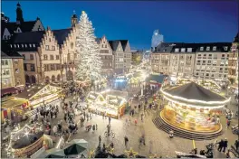  ?? MICHAEL PROBST - THE ASSOCIATED PRESS ?? Lights illuminate the Christmas market in Frankfurt, Germany, Nov. 22.