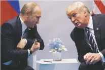  ?? ASSOCIATED PRESS FILE PHOTO ?? Russian President Vladimir Putin, left, meets with President Donald Trump at the July 7 G-20 Summit in Hamburg, Germany. The Kremlin and the White House announced Thursday that a July 16 summit between Putin and Trump will take place in Helsinki,...