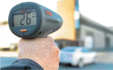  ?? AMY SHORTELL/THE MORNING CALL ?? The Road Warrior uses a radar gun to clock traffic in Allentown as he begins checking out areas that readers requested.