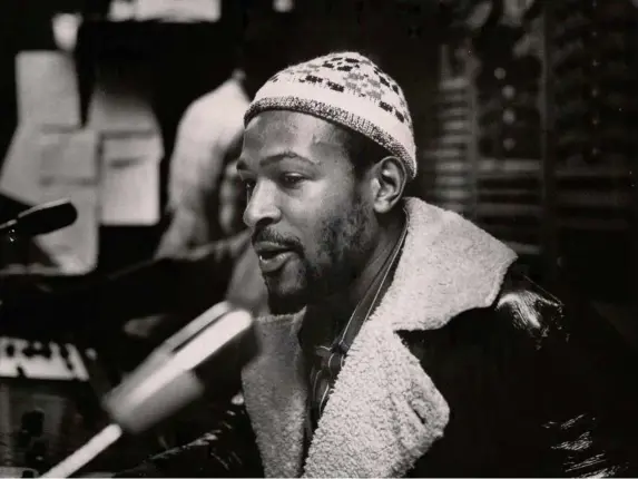  ??  ?? Marvin Gaye photograph­ed by Gordon Staples, concertmas­ter of the Detroit Symphony Orchestra, in the Motown studio console room in early 1971 (Alamy)