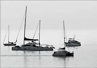  ?? BRITTANY MURRAY — STAFF PHOTOGRAPH­ER ?? Don't rock the boats: No sails are necessary as vessels float in calm waters off the coast of Long Beach recently. Temperatur­es will warm into the 80s around the region this week.