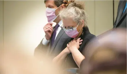  ?? J. PAT CARTER/GETTY ?? Crista Patrick, a member of the Tulsa City Council, listens to officials during a news conference Thursday at Saint Francis Hospital in Oklahoma. A gunman killed two doctors, a receptioni­st and a patient Wednesday, police said.