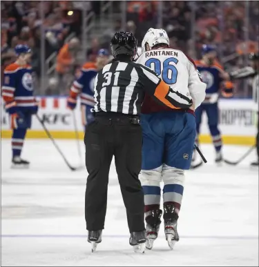  ?? JASON FRANSON — THE CANADIAN PRESS VIA AP ?? The Avalanche’s Mikko Rantanen is helped off after being hit by the Oilers’ Mattias Ekholm Friday in Edmonton, Alberta.