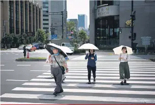  ?? Martin Bureau/AFP ?? Em Tóquio, temperatur­a chegou a 40,8ºC, a mais alta da história na cidade