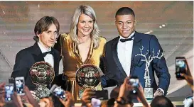  ?? AFP ?? Luka Modric, Ada Hegerberg y Kylian Mbappé.