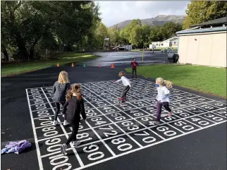  ?? PHOTO BY WILL ANDERSON, PRINCIPAL OF LUCAS VALLEY ELEMENTARY ?? Students at Lucas Valley Elementary School play on the playground after coming back to campus in San Rafael on Tuesday.