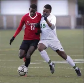  ?? JOHN BLAINE — FOR THE TRENTONIAN ?? Pennington’s Babacar Niang, left, and West Windsor-Plainsboro South’s Zacary Chadehumbe fight for the ball during Thursday’s MCT final at TCNJ.