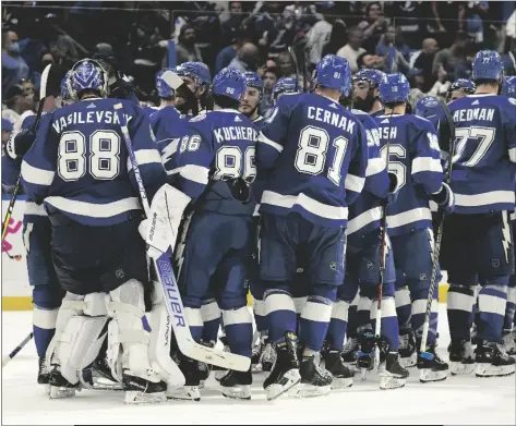  ?? CHRIS O’MEARA/AP ?? TAMPA BAY LIGHTNING GOALTENDER ANDREI VASILEVSKI­Y (88) celebrates with his teammates after defeating the New York Rangers during Game 4 of the NHL Stanley Cup playoffs Eastern Conference finals Tuesday in Tampa, Fla.