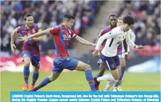  ??  ?? LONDON: Crystal Palace’s Scott Dann, foreground left, vies for the ball with Tottenham Hotspur’s Son Heung-Min, during the English Premier League soccer match between Crystal Palace and Tottenham Hotspur, at Wembley Stadium, in London. — AP