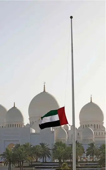 ?? AFP ?? The UAE flag flies at half-staff outside Sheikh Zayed Grand Mosque in Abu Dhabi