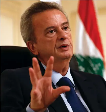  ??  ?? Lebanon’s central bank Governor Riad Salameh speaks during an interview at his office in Beirut. (Reuters)