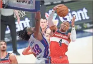  ?? AP-Nick Wass ?? Washington Wizards guard Russell Westbrook (4) grabs the ball next to Detroit Pistons center Isaiah Stewart (28) on March 27 in Washington.