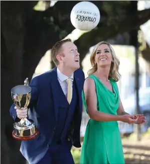  ?? Colm Cooper with girlfriend Céitilís Ní Bheaglaioc­h and the Kerry Associatio­n in Dublin Kerry Person of the Year award. ??