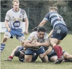  ??  ?? Lions’ Paino Hahea is stopped short of the line by the Sheffield defence