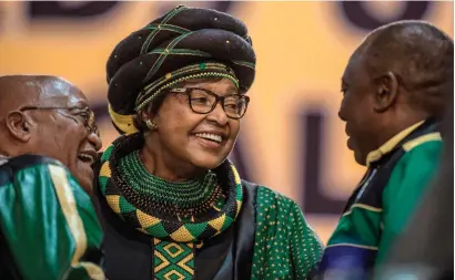  ?? AFP ?? Winnie Mandela (C) hugs President Jacob Zuma (L) and Deputy President Cyril Ramaphosa in Johannesbu­rg on Saturday. —