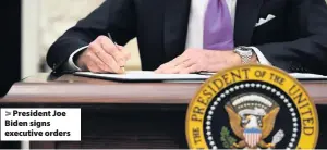  ??  ?? > President Joe Biden signs executive orders