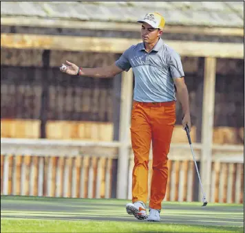  ?? CURTIS COMPTON / CCOMPTON@AJC.COM ?? Rickie Fowler reacts to his bogey on the 11th hole. The world’s No. 8 golfer played the back nine in 40 on the way to a 76 for the day.