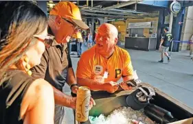  ?? AP PHOTO/GENE J. PUSKAR ?? Tom Congdon, a vendor at Pittsburgh sports venues for 38 years, mans his beer and water cart in the concourse at PNC Park for Monday’s game between the Pittsburgh Pirates and the Atlanta Braves in Pittsburgh.
