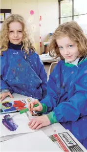  ??  ?? Enjoying painting during art class at Bona Vista Primary School are sisters Kaylee (left) and Izzy Williams.