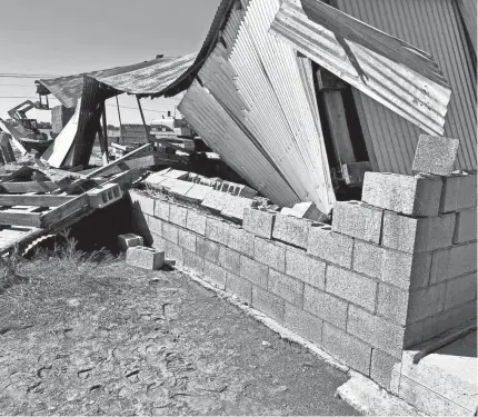  ?? PHOTOS BY JOHN STOTTS ?? Winds from a storm Sunday partially collapsed a barn on the land owned by the Nowakowski family.