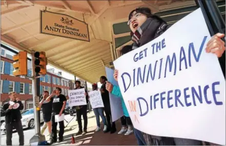  ?? PETE BANNAN – DIGITAL FIRST MEDIA ?? Bryn Mawr College junior, Ann Tran protests outside state Sen. Andy Dinniman’s West Chester office Monday afternoon to demand protection­s for immigrant students.