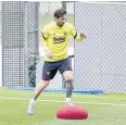  ?? AFP ?? Barcelona’s Lionel Messi takes part in a training session.